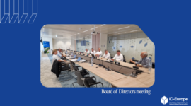Board of Directors meeting in a modern conference room; attendees surround a long table with laptops and microphones; IC-Europe logo bottom right.